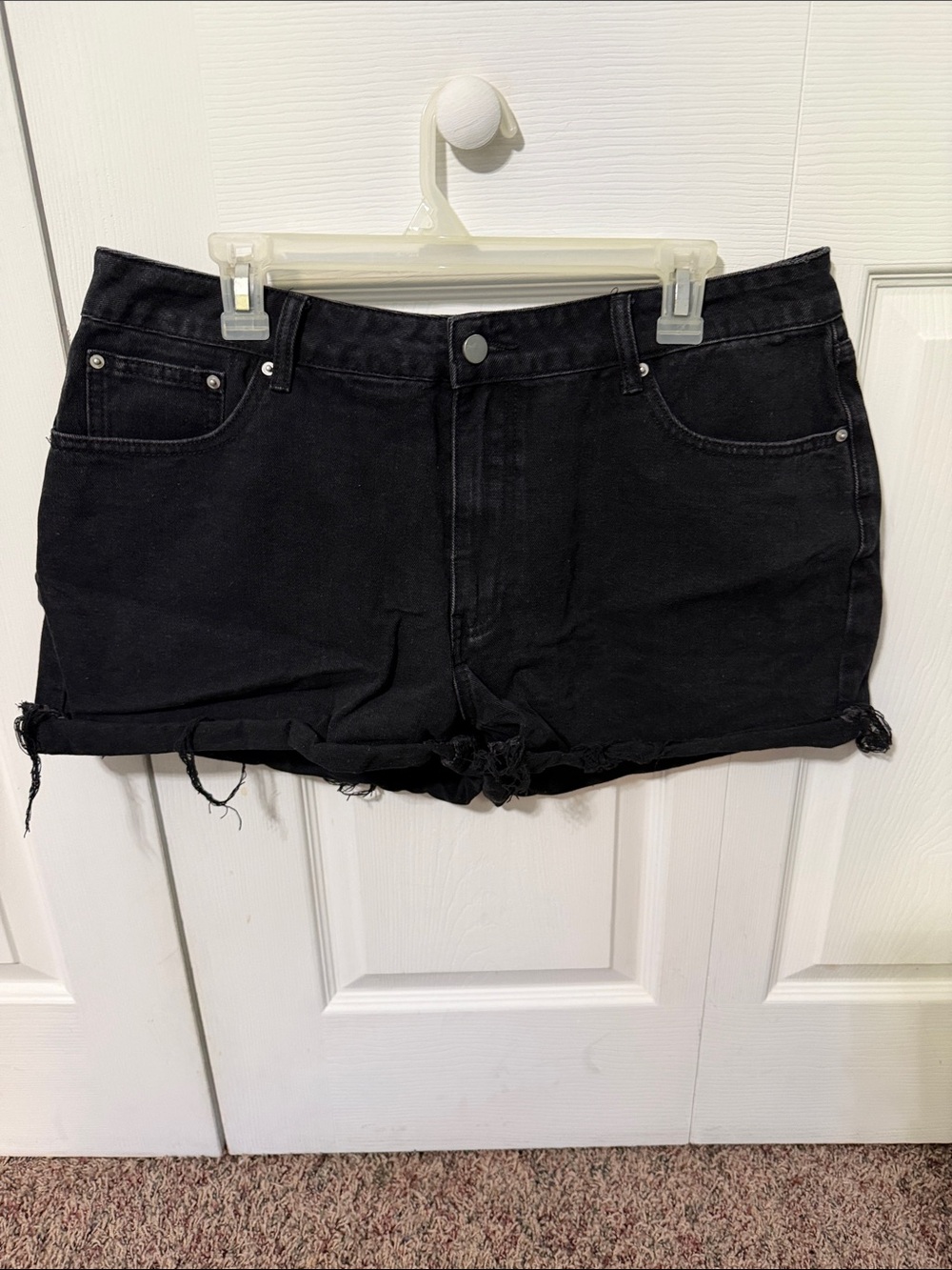 Black denim shorts with frying